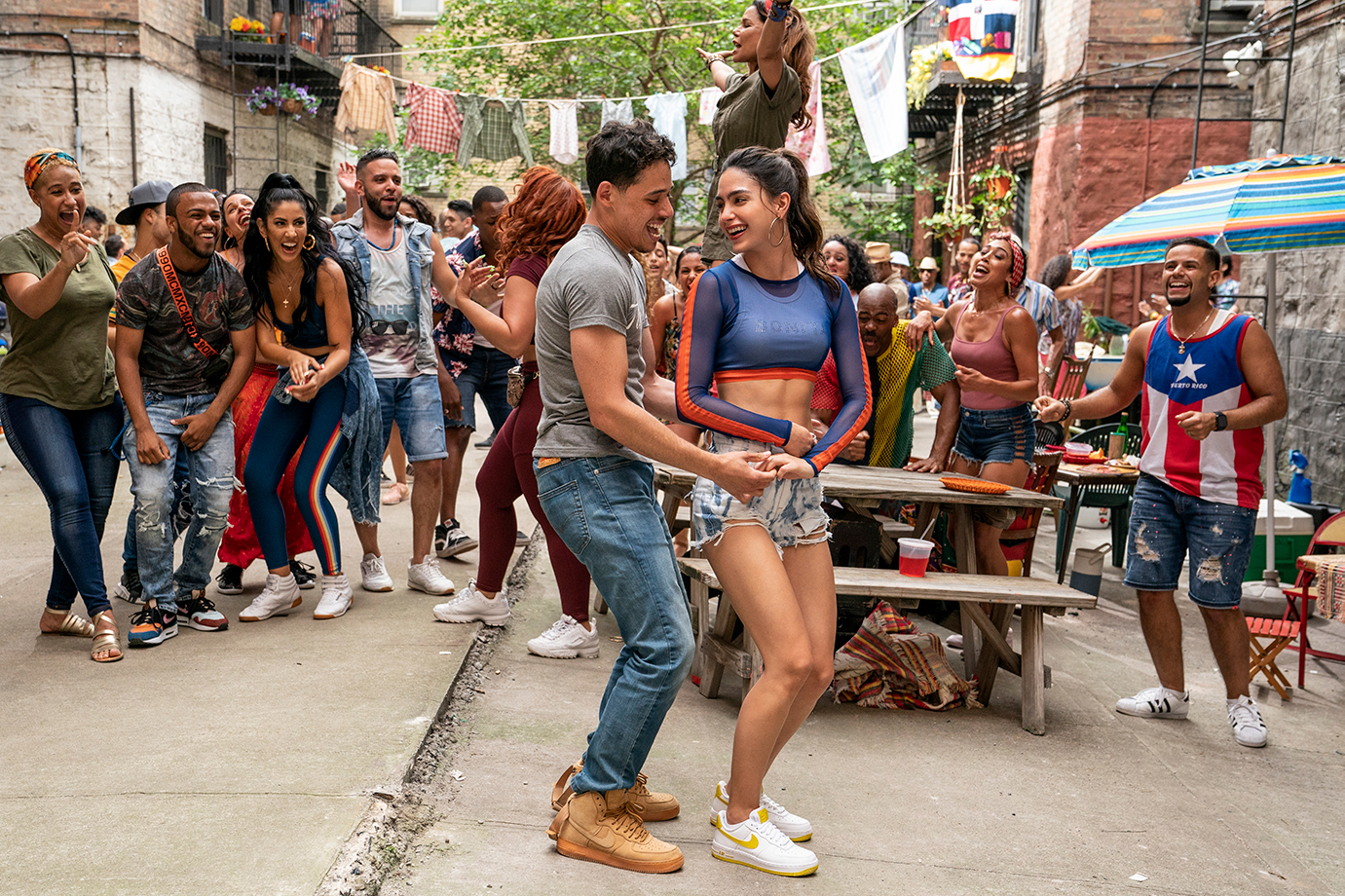 (Left Center-Right Center) ANTHONY RAMOS as Usnavi and MELISSA BARRERA as Vanessa in Warner Bros. Pictures’ “IN THE HEIGHTS,” a Warner Bros. Pictures release.