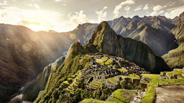 View of the ancient Inca City of Machu Picchu. The 15th century Inca site.' Lost city of the Incas'. Ruins of the Machu Picchu sanctuary. UNESCO World Heritage site. - 2022 Uncharted Discovery Four Seasons Private Jet