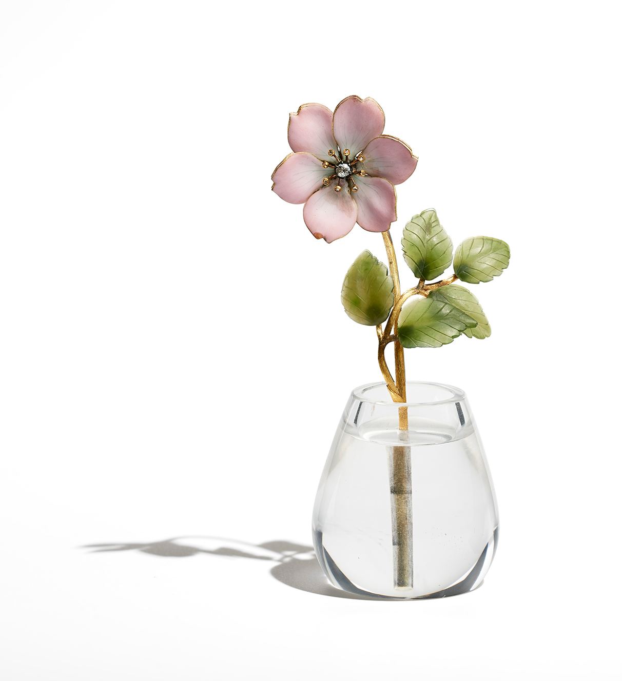 Painted enamel rose with nephrite leaves standing in a rock crystal pot, from Fabergé's London stock when the branch closed in 1917 © Wartski, London