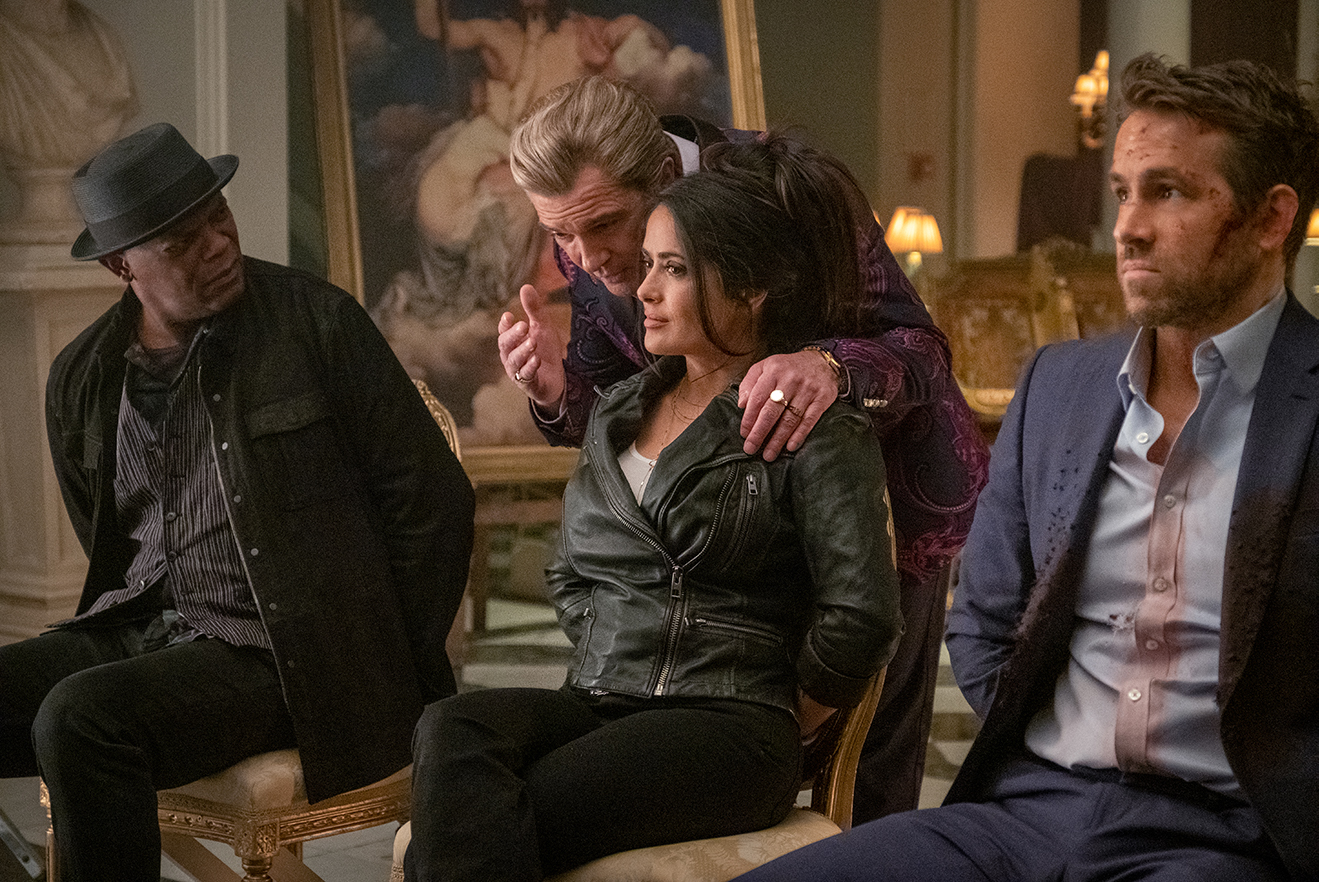 Samuel L. Jackson as ‘Darius Kincaid,’ Antonio Banderas as ‘Aristotle Papadopolous,’ Salma Hayek as ‘Sonia Kincaid,’ and Ryan Reynolds as ‘Michael Bruce’ in THE HITMAN’S WIFE’S BODYGUARD.