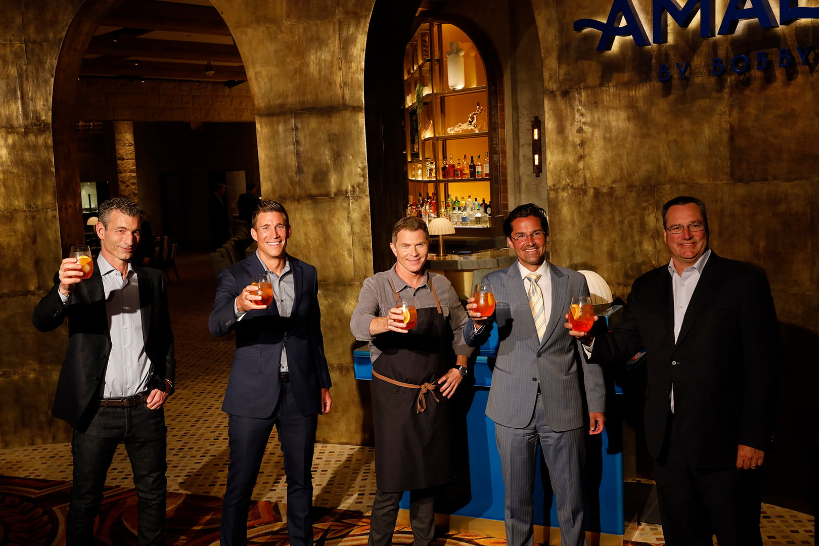 (L to R) - Business Partner Laurence Kretchmer, Caesars Entertainment President & COO Anthony Carano, Chef Bobby Flay, Caesars Entertainment Regional President Sean McBurney, Caesars Entertainment CEO Tom Reeg at the Amalfi by Bobby Flay Grand Opening Event at Caesars Palace Las Vegas