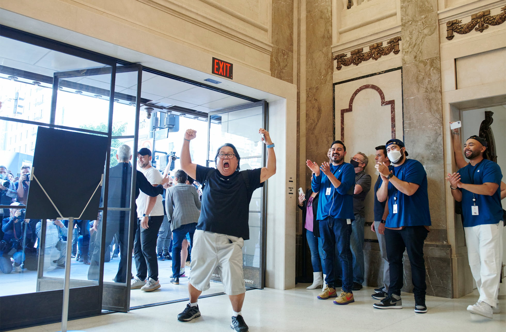 Apple team members greet the first customers at the grand opening of Apple Tower Theatre.