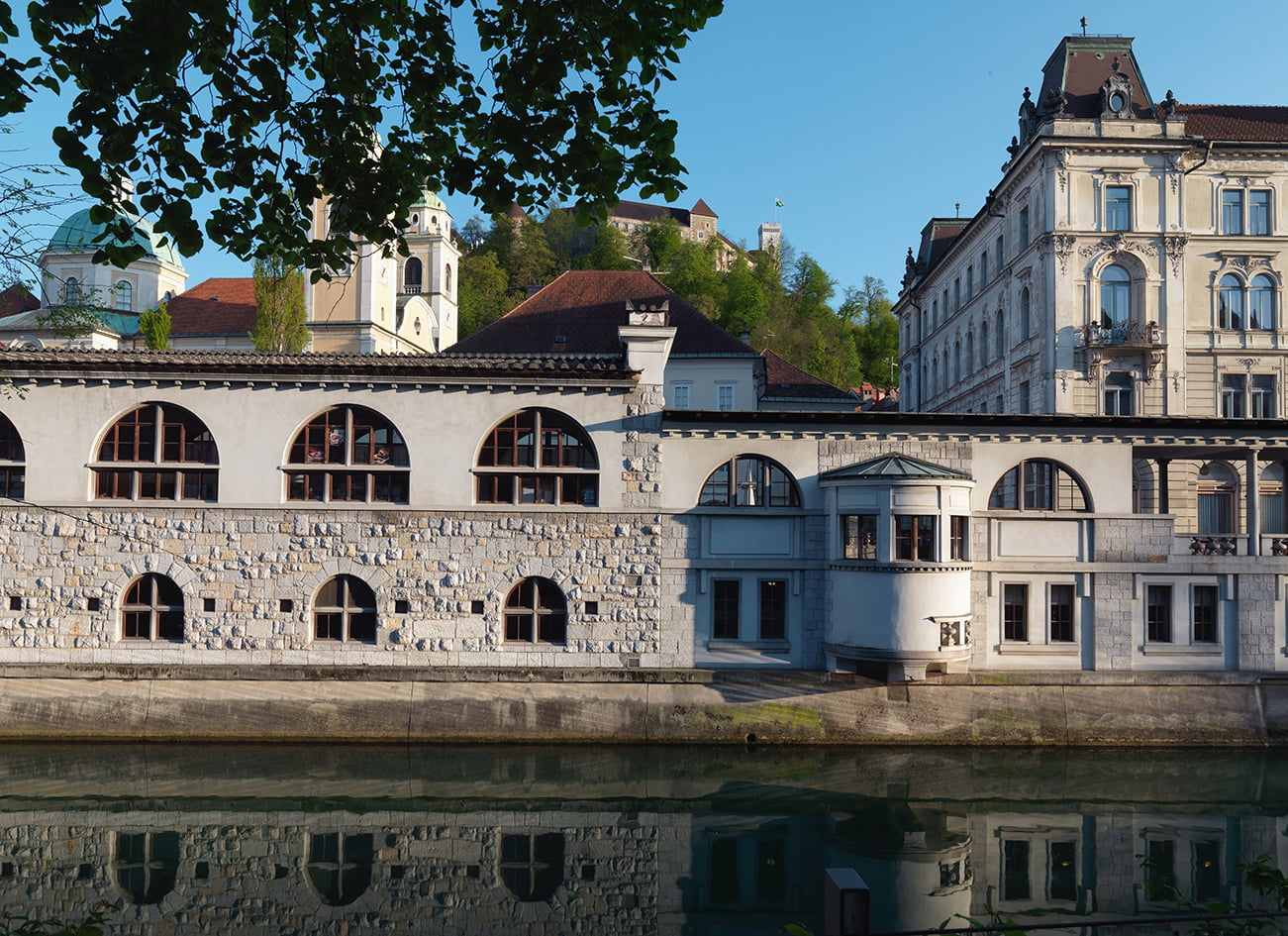 The work Jože Plečnik in Ljubljana - Human Centred Urband Design - Slovenia - View of the river side facade with a pier housing the spiral staircase