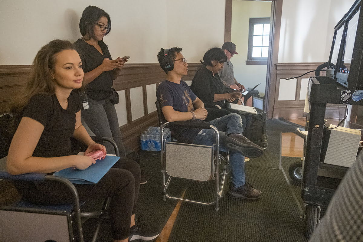 (Left) INGRID BISU and (Center) Director/Producer JAMES WAN on the set of New Line Cinema, Starlight Media Inc. and My Entertainment Inc.’s original horror thriller MALIGNANT, an Atomic Monster production, a Warner Bros Pictures release.