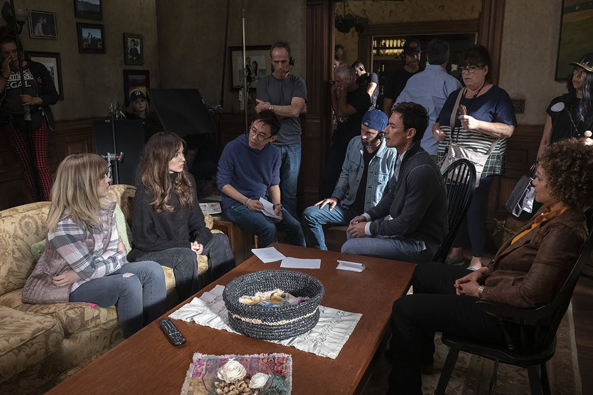 (L-r around the table) MADDIE HASSON, ANNABELLE WALLIS, Director/Producer JAMES WAN, Director of Photography MICHAEL BURGESS, GEORGE YOUNG and MICHOLE BRIANA WHITE on the set of New Line Cinema, Starlight Media Inc. and My Entertainment Inc.’s original horror thriller MALIGNANT, an Atomic Monster production, a Warner Bros Pictures release.