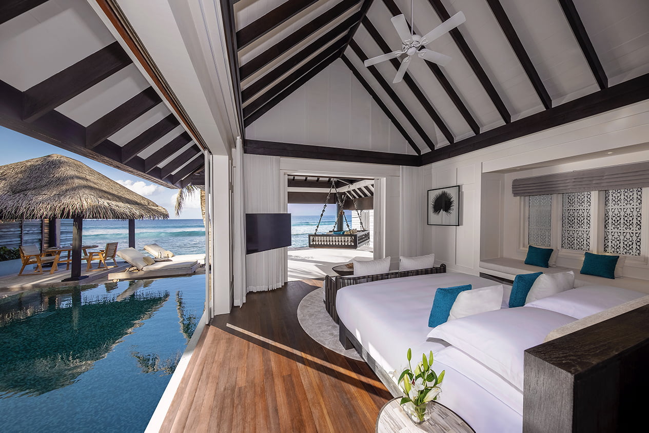 Naladhu Private Island - Ocean House - Bedroom Interior with Pool and Deck view