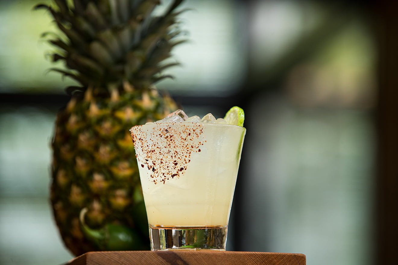 The Feel More with tequila reposado & mezcal infused with pineapple, lime juice, ginger syrup, jalapeño, and cilantro served with an aleppo chile salted rim - The Rock & Rye at Sweetwater Music Hall