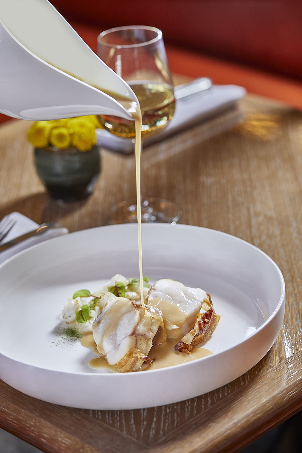 Roasted monkfish on a base of bacon, squid and Iberian gravy from Dani García brasserie