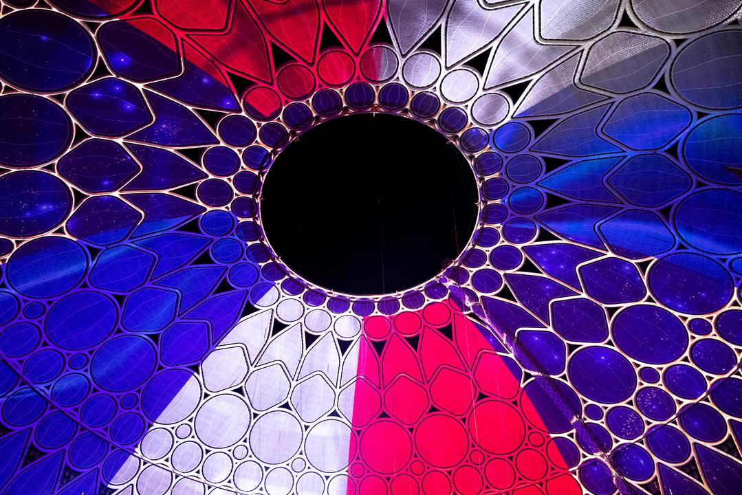 Al Wasl Dome lit in the colours of the French flag during the France National Day Ceremony