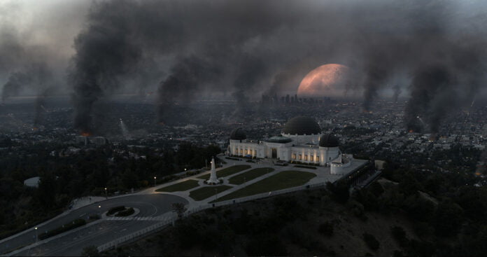 Fires, looting, and destruction across the Los Angeles skyline and Griffith Observatory as the Moon falls to the Earth in the sci-fi epic MOONFALL.