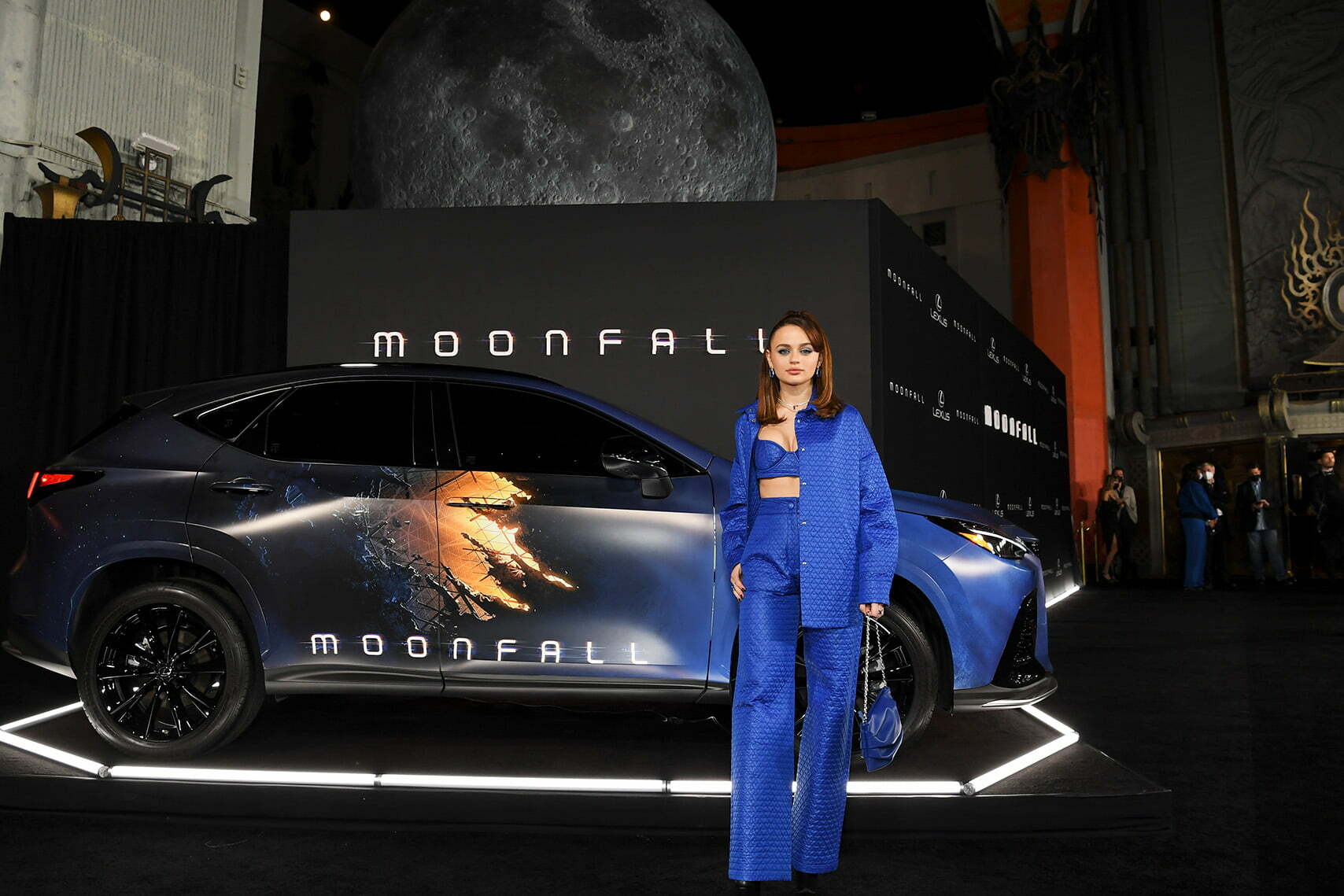 HOLLYWOOD, CALIFORNIA - JANUARY 31: Joey King poses in front of the Museum of the Moon by British Artist Luke Jerram at the "Moonfall" premiere in partnership with Lexus at TCL Chinese Theatre on January 31, 2022 in Hollywood, California.