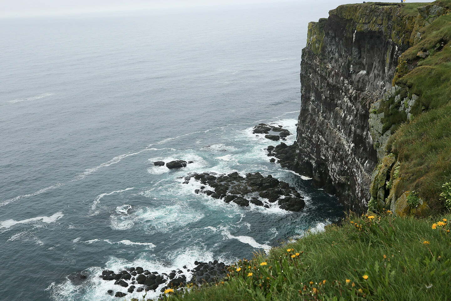 Breaking waves onto cliffs.