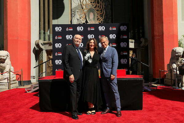 Michael G Wilson, Barbara Broccoli, Christoph Waltz at a ceremony honoring producers Michael G Wilson and Barbara Broccoli with hand and foot prints at the TCL Chinese Theatre IMAX on September 21, 2022 in Los Angeles, CA