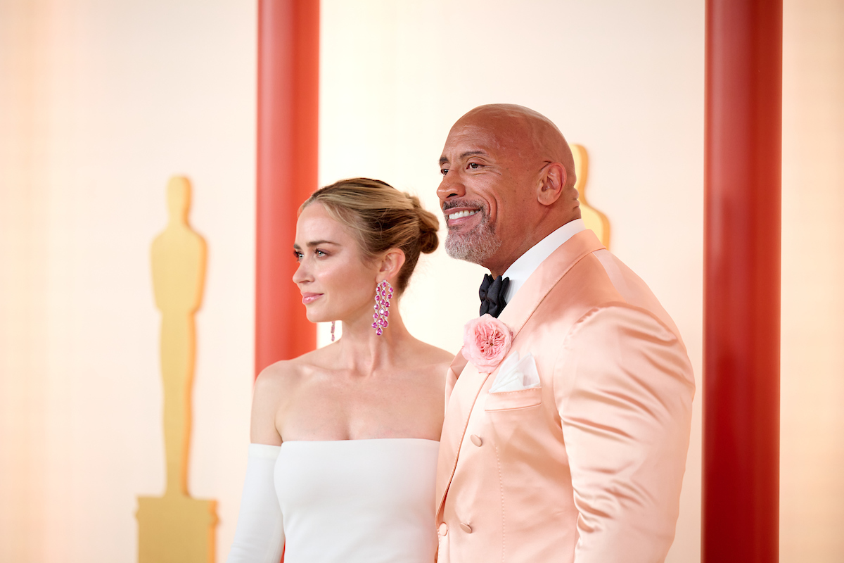 Emily Blunt and Dwayne Johnson arrive on the red carpet of The 95th Oscars® at the Dolby® Theatre at Ovation Hollywood on Sunday, March 12, 2023.