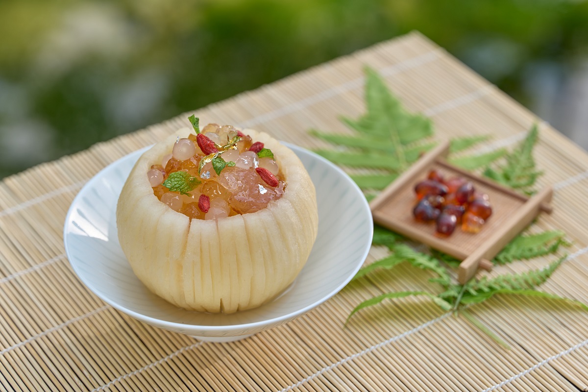 HOSHINOYA Guguan - dessert of sweet pears soaked in syrup and stuffed with tao jiao, wolfberry, acacia seeds, and peach vinegar tea