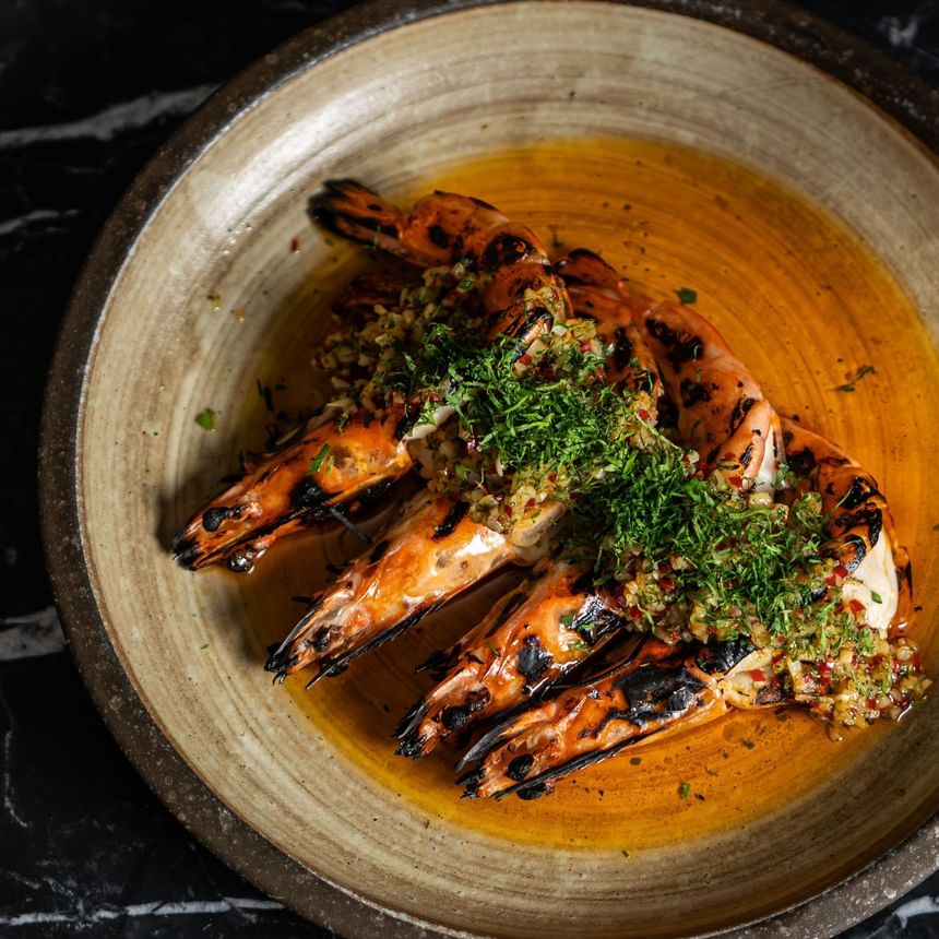 Jumbo tiger prawns, chilli and Amalfi lemon garlic oil - May Fair Kitchen in London