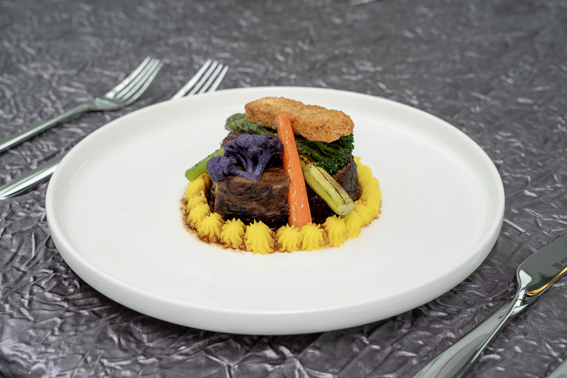 Black angus “beef bourguignon”, saffron potato mousseline, spring vegetables and garlic crouton