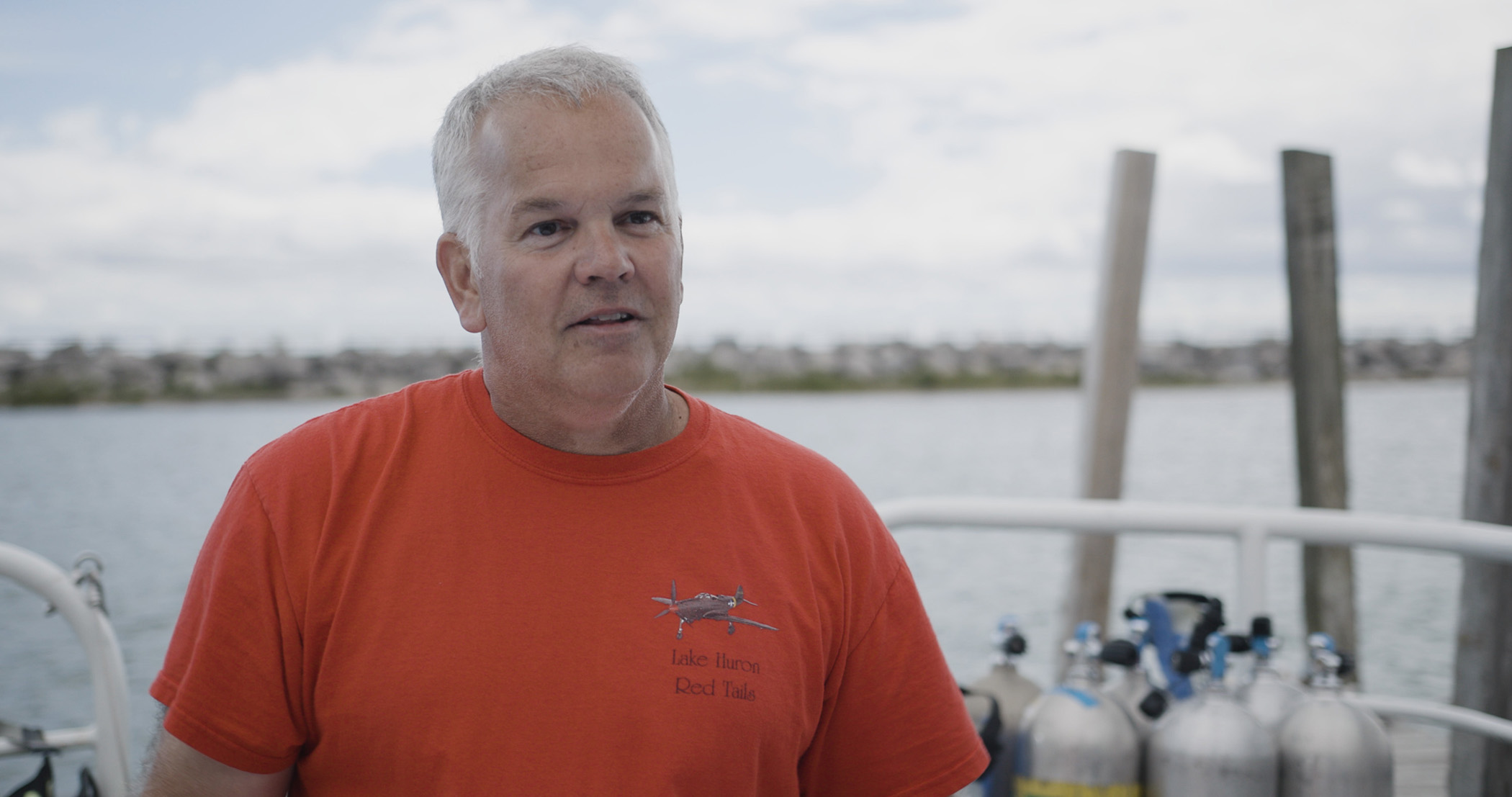 Michigan's State Maritime Archaeologist Wayne Lusardi sits for an interview in Port Huron, Mich.