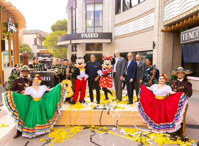 From left to right on stage: Mariachi Divas; Mickey Mouse; Chef Carlos Gaytán; Minnie Mouse; Jason Smith, Downtown Disney District; Jerry Jacobs Jr., Delaware North; John 