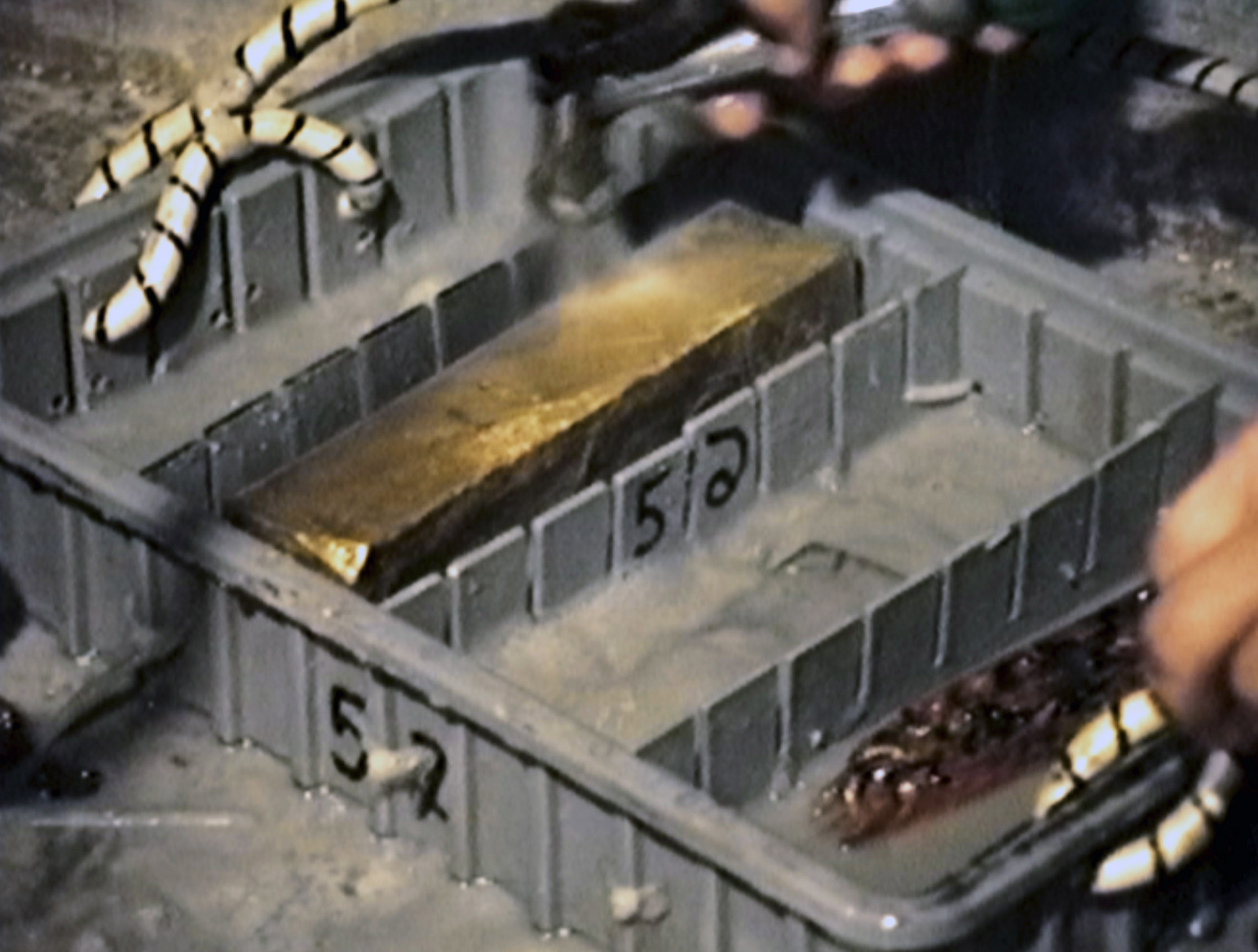 Gold bars in plastic retrieval boxes are placed on deck after being found and brought up from the bottom of the seabed off the coast of North Carolina, USA.