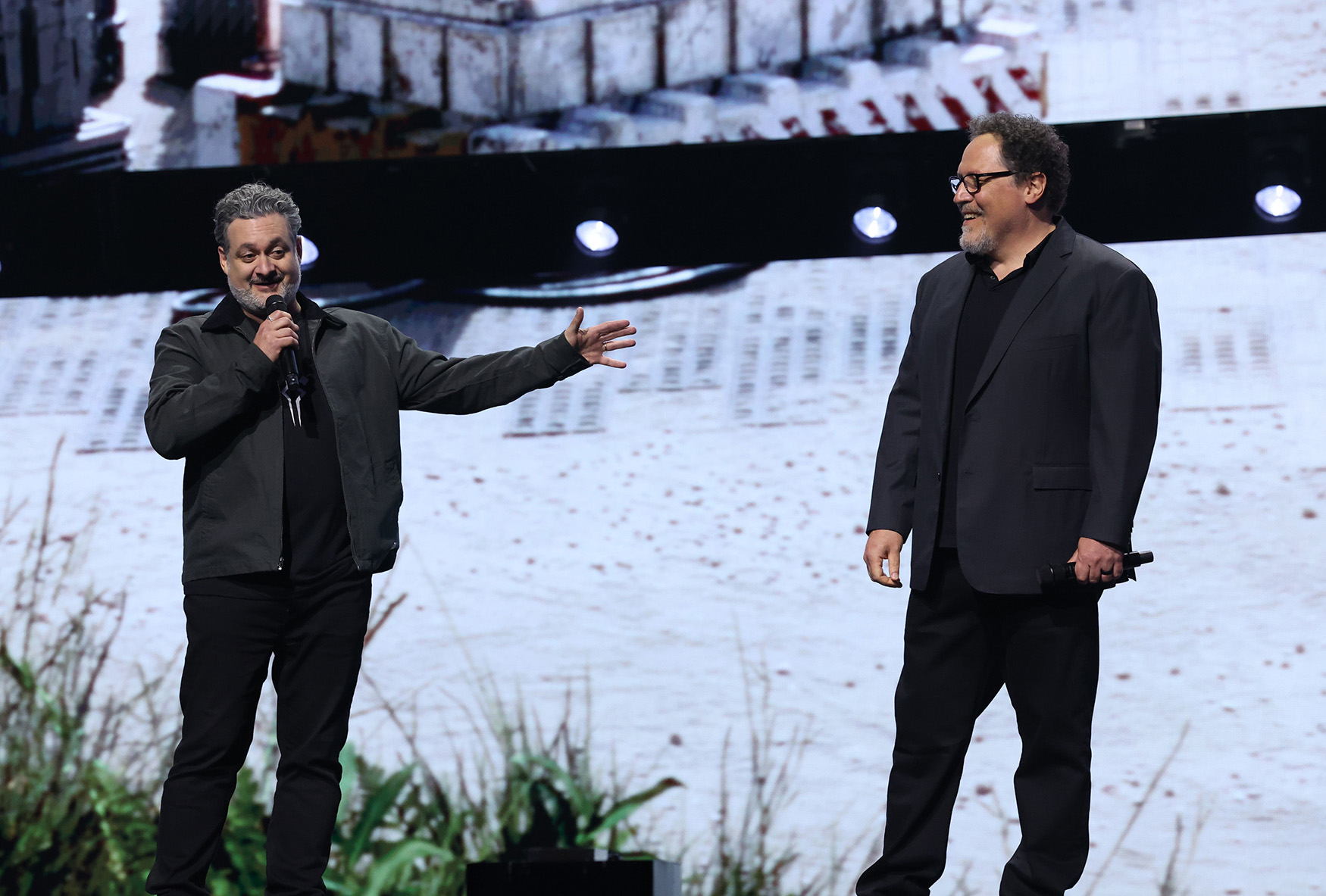 (L-R) Dave Filoni, Chief Creative Officer, Lucasfilm and Jon Favreau appear at the Disney Entertainment Showcase at D23: The Ultimate Disney Fan Event in Anaheim, California on August 09, 2024. 