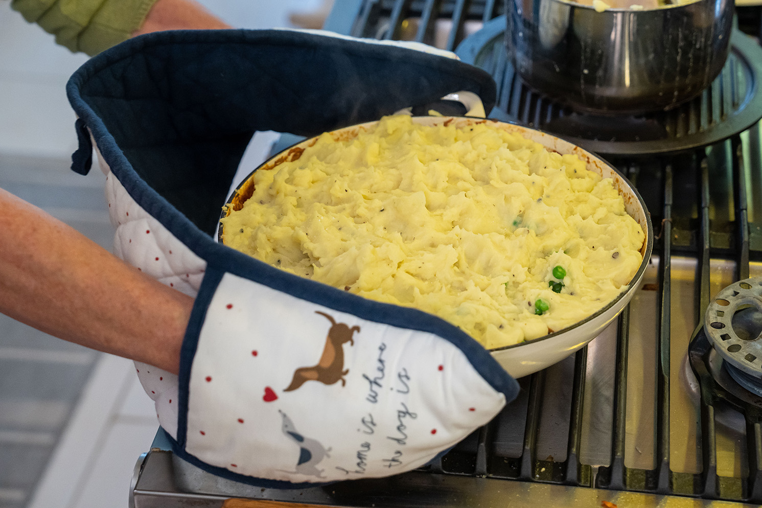 The Shepherd's Pie is put into the oven.