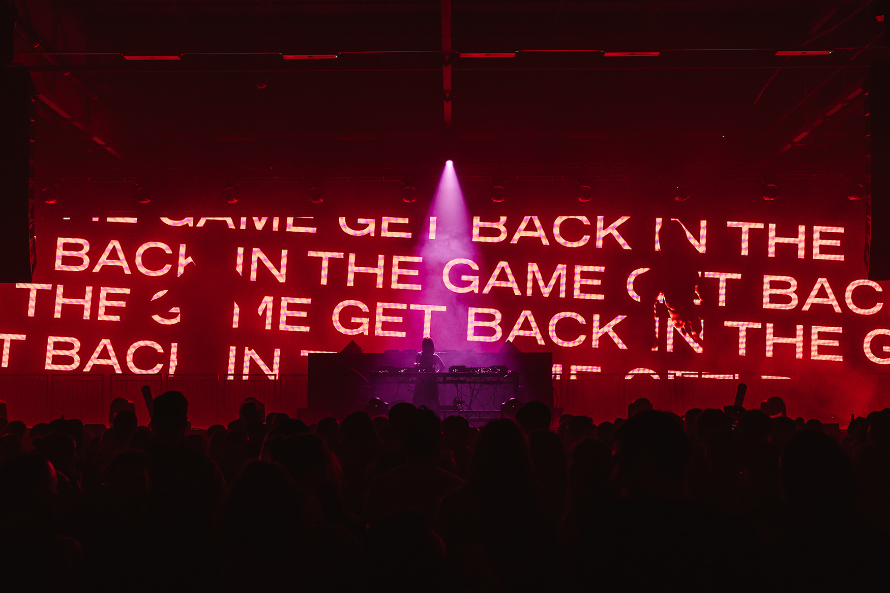 A DJ performs at Squid Game The Rave in London on December 18